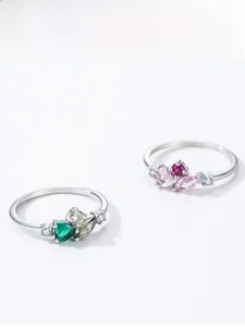 Detail of S925 silver rings featuring pear-cut pink and green zircon stones