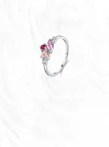 Detailed close-up of S925 sterling silver ring with pink zircon and heart stones