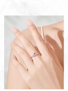 Close-up of S925 sterling silver ring with pink zircon clusters on model finger