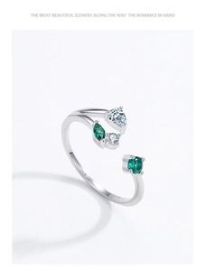 Close-up of S925 sterling silver branch ring with green gems and zircons