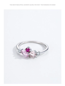 Macro shot of S925 silver ring featuring pink heart and marquise zirconia stones
