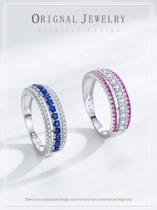 Macro detail of 925 sterling silver hollow rings with blue and pink stones