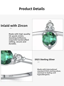 Macro detail of S925 sterling silver ring band with 5A emerald green zircon gemstone