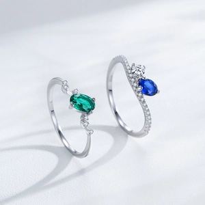 Elegant S925 silver rings set featuring green and blue oval gemstones with zircon accents