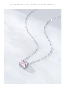 Macro detail of square pink gemstone pendant with silver micro-pave setting