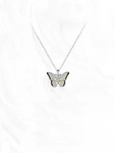 Close-up of a 925 silver butterfly necklace with colorful enamel and yellow gemstone