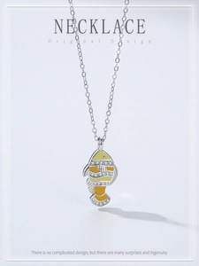 Detail view of 925 silver clownfish pendant with vibrant enamel and cubic zirconia