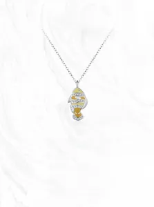 Detailed macro view of 925 silver clownfish pendant with enamel and white zircon stones