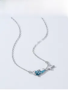 Detailed close-up of 925 silver koi fish pendant with blue enamel and sparkling zircon stones