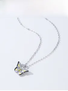 Detailed macro view of S925 silver butterfly pendant with colorful enamel and zircons