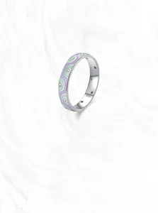 Detail of 925 sterling silver ring with lavender enamel and sparkling zircon stone