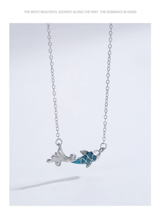Detailed view of 925 silver koi pendant with blue enamel gradient and sparkling zircons