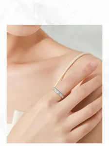 Detail of lavender and green enamel ring on model hand with a bohemian style