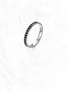 Macro shot of S925 sterling silver ring showing retro black arrow texture and hallmark
