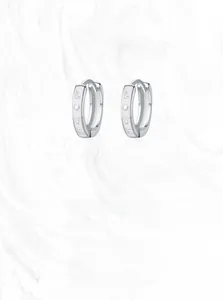 Macro shot of S925 sterling silver hoop earrings with LOVE engraving and S925 hallmark