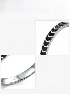 Macro shot of S925 sterling silver ring featuring black enamel V-shape chevron texture