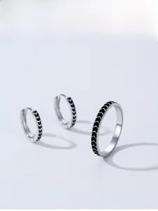 Macro view of S925 sterling silver jewelry set with black chevron enamel patterns