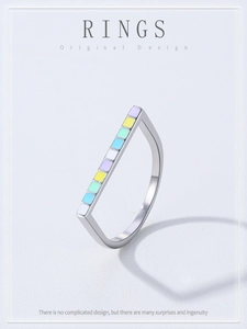 Macro shot of S925 silver U-shape ring with colorful rainbow enamel inlay squares