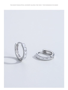Close-up of S925 sterling silver hoop earrings with LOVE engraving and heart symbol
