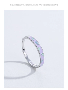 Detailed macro of S925 sterling silver ring with purple enamel and mint green wave patterns