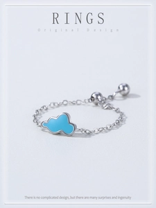 Detailed macro view of S925 silver chain ring featuring a blue cloud charm and slider bead