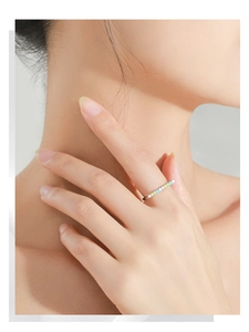 Detailed close-up of a slim S925 silver U-shape ring with pastel rainbow enamel inlay