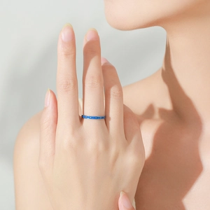 Elegant S925 sterling silver blue enamel ring shown on model for a minimalist jewelry look