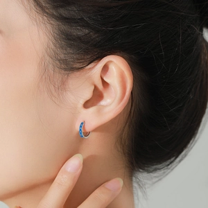 Vintage 925 silver hoop earrings with navy blue enamel and crystals on model