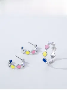 Close-up of S925 sterling silver set featuring colorful enamel inlay earrings and ring