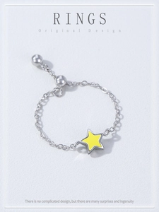Detail of S925 sterling silver chain ring with yellow enamel star and adjustable slider bead