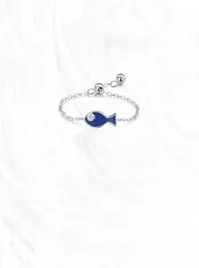 Detailed macro of S925 silver blue enamel fish ring with adjustable chain design