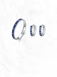 Detailed view of S925 sterling silver jewelry set featuring blue enamel and silver dots