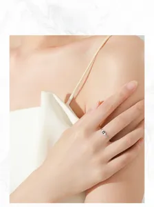 Silver chain ring featuring a classic evil eye motif with an inset crystal on a finger