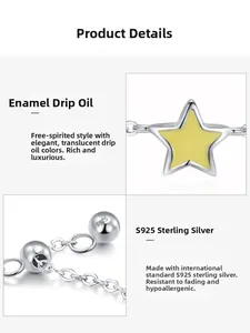 Detailed macro of S925 sterling silver stamp and yellow enamel star pendant on a chain ring