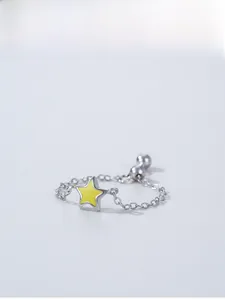 Detailed view of yellow star enamel 925 sterling silver chain ring with metal beads