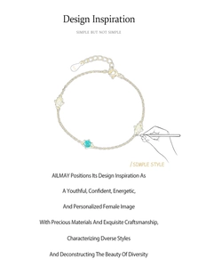 Macro detail of S925 sterling silver gold bracelet with teal and clear round zircons
