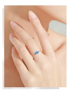 Detail showing S925 sterling silver chain ring with blue enamel fish and tiny diamond