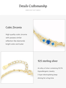 Detail of S925 sterling silver gold bracelet with blue zirconia and adjustable chain