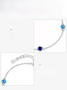 Macro detail of S925 silver bracelet featuring blue 5A zircons and authenticity hallmark