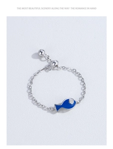 Close-up of S925 silver adjustable chain ring with blue enamel fish charm and zircon eye