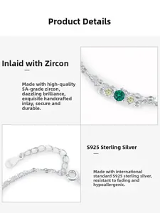 Detailansicht eines zweilagigen S925 Sterlingsilber-Armbands mit grünen und gelben Zirkonen