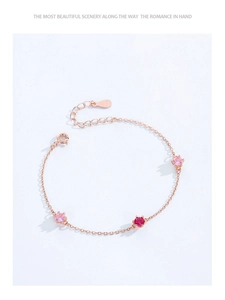 Detail of rose gold plated S925 silver bracelet with pink and red zircon stones