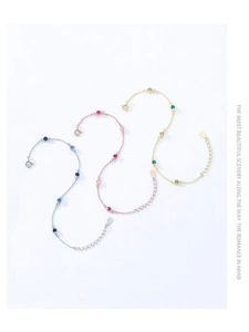 Detailed view of S925 sterling silver bracelets with pink, blue, and green crystals