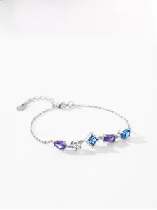 Close-up of S925 silver bracelet featuring five varied geometric purple and blue zircons
