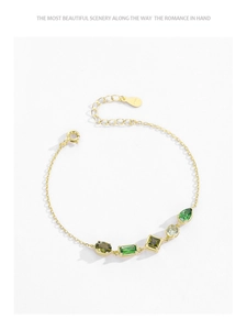 Macro detail of 925 sterling silver gold bracelet featuring multi-color gemstones