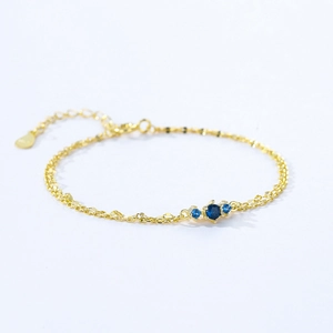 Exquisite 925 sterling silver gold bracelet with three round blue zircon gemstones