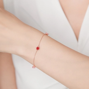 S925 sterling silver rose gold bracelet with pink and red zircon stones on woman's wrist