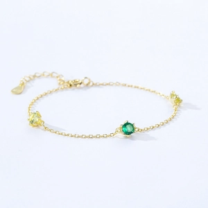 925 silver gold bracelet with green and yellow round zircons and heart charm