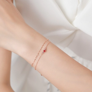 Elegant double-layer S925 silver bracelet in rose gold with a round red gemstone