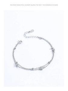 Close-up of S925 sterling silver double-layer bracelet with clover zircon pendant